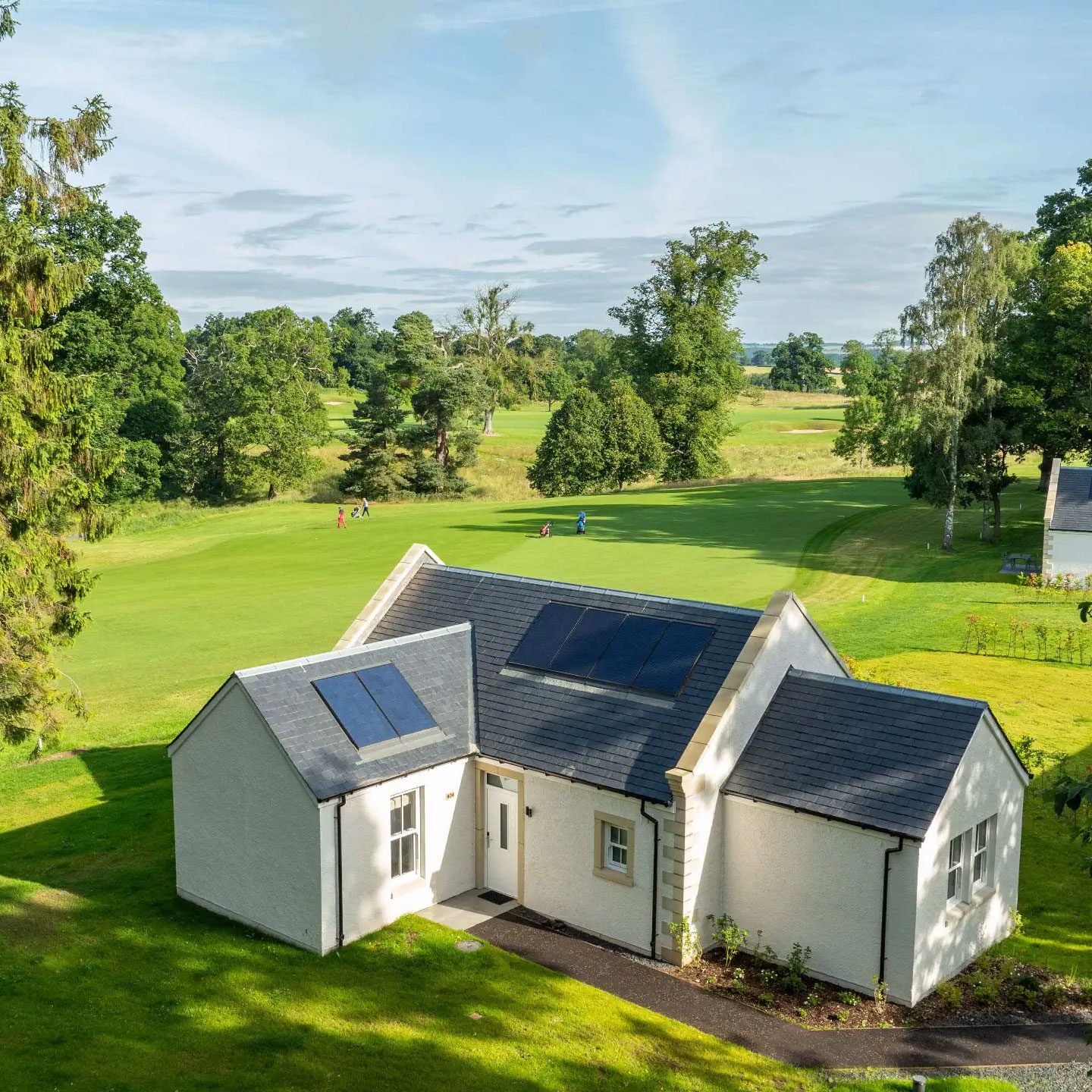 A whitewashed lodge overlooking the fairway at Schloss Roxburghe